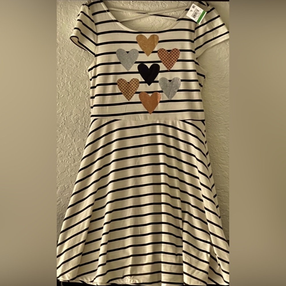 Girl dress size Medium white whit black strips and hearts as a decoration/